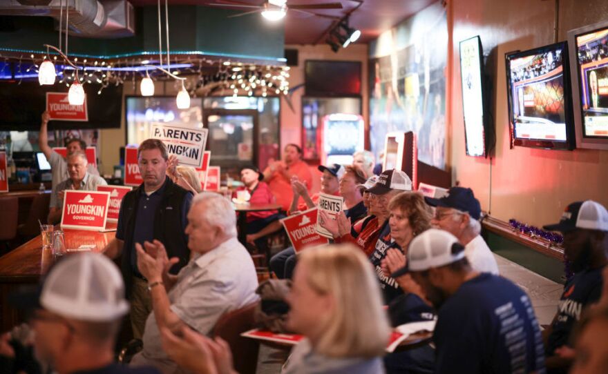 Supporters listen to Virginia Republican gubernatorial candidate Glenn Youngkin at a campaign event at the Azalea Inn & Time Out Sports Bar on Monday in Norfolk, Va.