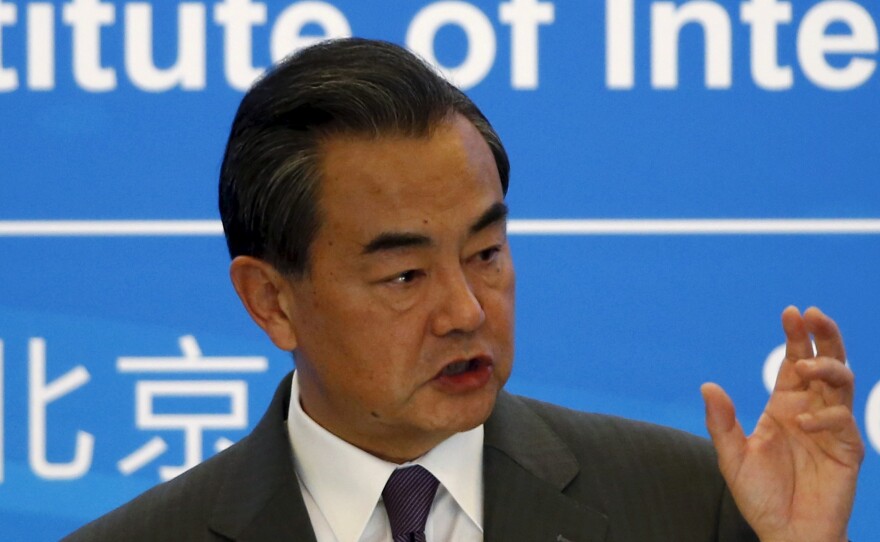 Chinese Foreign Minister Wang Yi delivers a speech during the international seminar commemorating the 10th anniversary of the September 19 joint statement of six-party talks at the Diaoyutai State Guesthouse in Beijing, China, on Saturday.