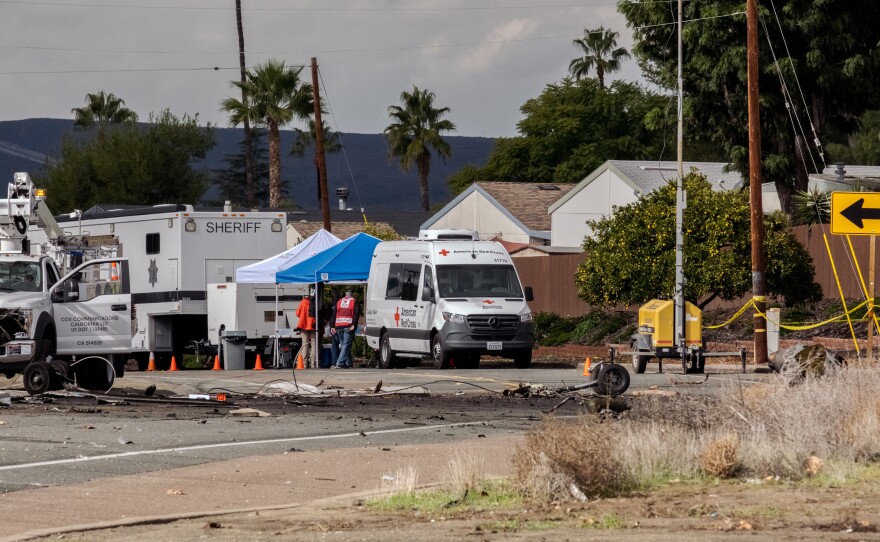 Debris is strewn across 1200 Pepper Drive in El Cajon while Investigators from the National Transportation Safety Board try to learn why the airplane crashed, December 29, 2021.