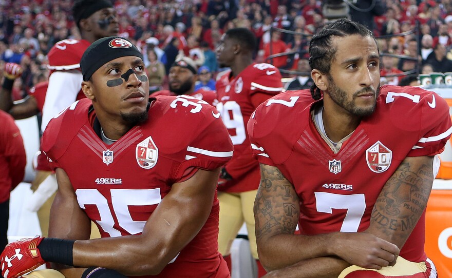 San Francisco 49ers Eric Reid (35) and Colin Kaepernick (7) take a knee during the National Anthem prior to their season opener against the Los Angeles Rams during an NFL football game on Monday, Sept. 12, 2016, in Santa Clara, CA.