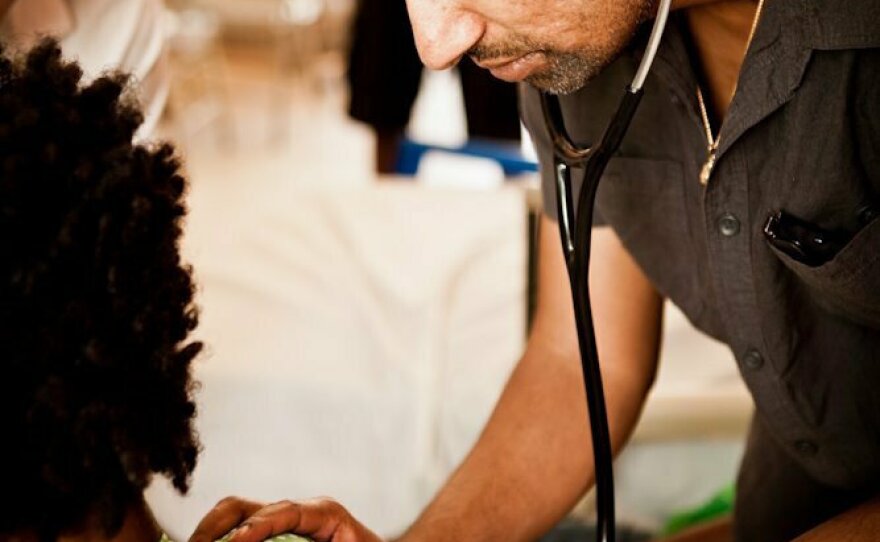 Dr. Sriram Shamasunder treating a patient in Haiti. His wish: "The time has come to bring the health effects of war into every training program of every health worker, everywhere."