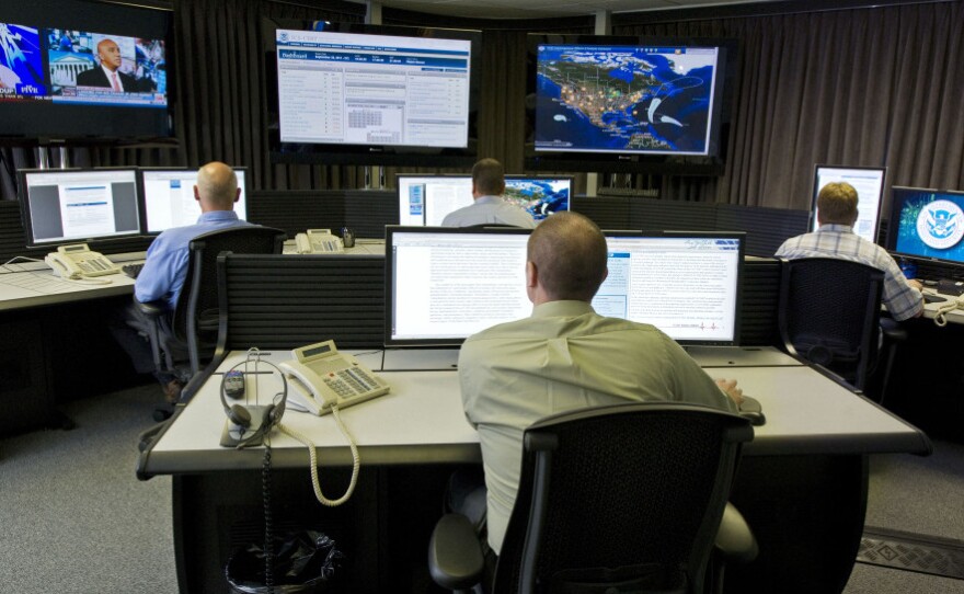 Cybersecurity analysts work in the watch and warning center during the first tour of the government's secretive cyberdefense lab intended to protect the nation's power, water and chemical plants, electrical grid and other facilities on Sept. 29, 2011, in Idaho Falls, Idaho.