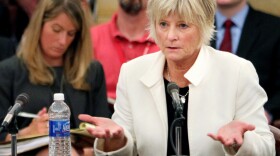 Deb Waldin testifies about her experience with a debt collector at a Minnesota hospital during a hearing led by Sen. Al Franken in St. Paul, Minn., in late May.