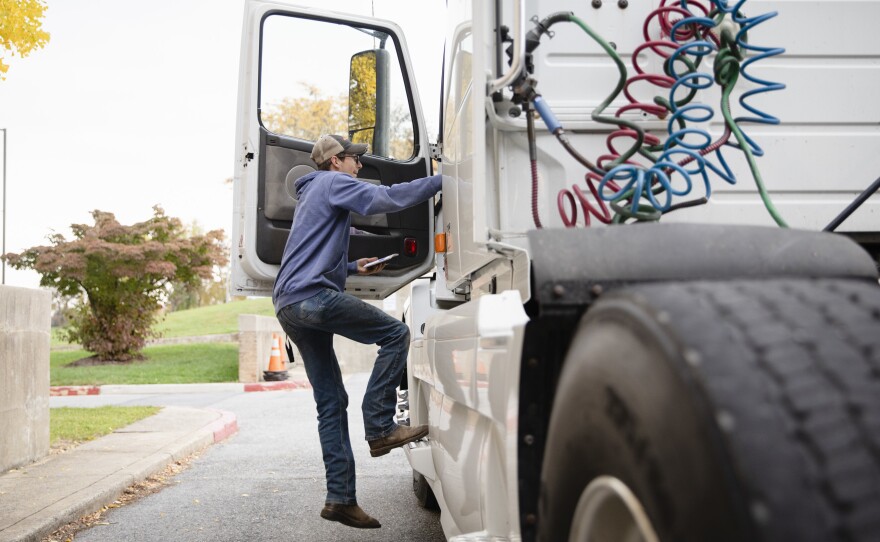 Tucker Bubacz, a 17-year-old senior, climbs into the cab of a semi truck just outside Williamsport High School in Williamsport, Md. on Monday, Oct. 17, 2022.