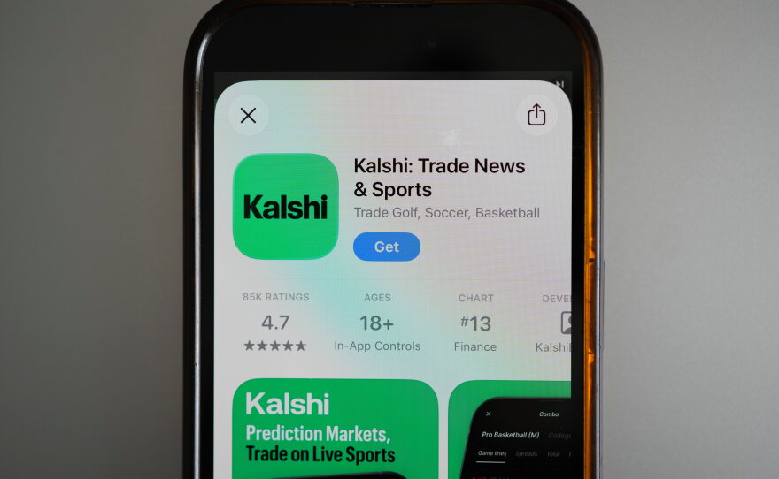 FILE - An ad for the prediction market app Kalshi is displayed on a mobile phone on April 16, 2026, in Chicago. (AP Photo/Erin Hooley, File)