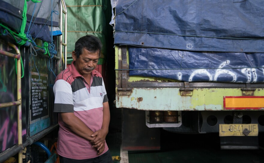 Rahmat, 53, is transporting a truck full of chips to Lombok. He travels by ferry about once a month from East Java, where he lives.
