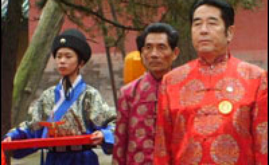 Confucius' 77th generation descendent Kong Deban (right) attends his ancestor's birthday celebrations.