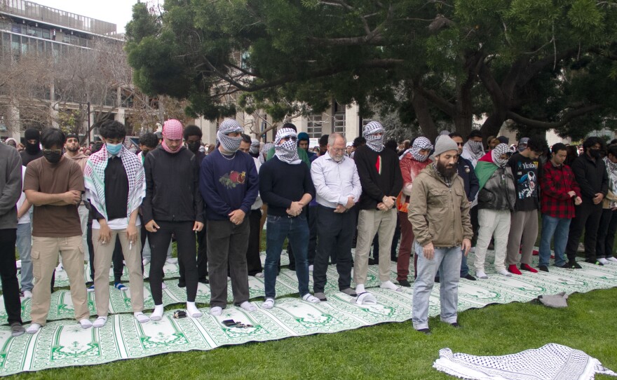 People line up for an evening prayer at a protest for Gaza. UCSD in San Diego, Calif. March 6, 2024.