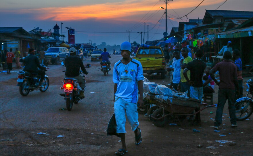 The main street in Ganta, Liberia at dusk.