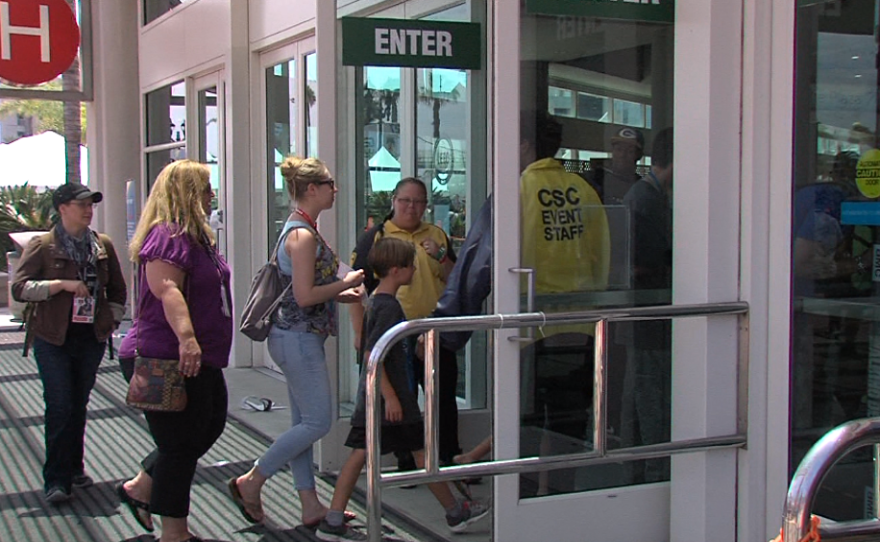 Helix Charter High School teachers Julie Damschen and Ashley Golden walk into Hall H of Comic-Con, July 20, 2017.