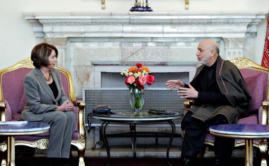 Zabihullah Tamanna was a photographer in Afghanistan for years. Here, one of his images of Afghanistan President Hamid Karzai (right) during a talk with U.S. House Speaker Nancy Pelosi at the Presidential Palace in Kabul on February 21, 2009.