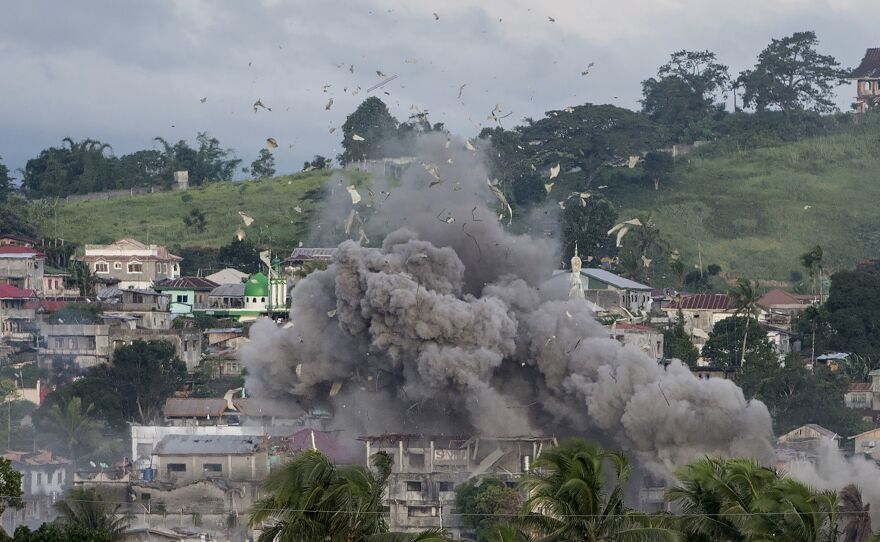 An airstrike rips through a suspected militant hideout in Marawi on Friday. The U.S. is now providing "technical assistance" in the fight to retake the city, according to a Philippine military spokesman.