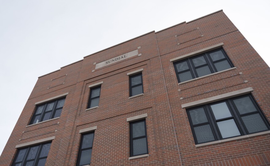 The brick facade of the Sundial Building.