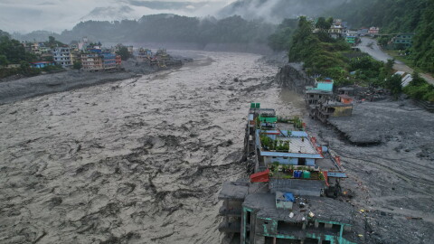 A drone view of the aftermath of flash flooding along the Trishuli river amidst fresh water surge warning in the Trishuli Bazaar area of Nuwakot district, Nepal, Sunday, Aug. 30, 2026. (AP Photo/Rajesh Kumar Singh)