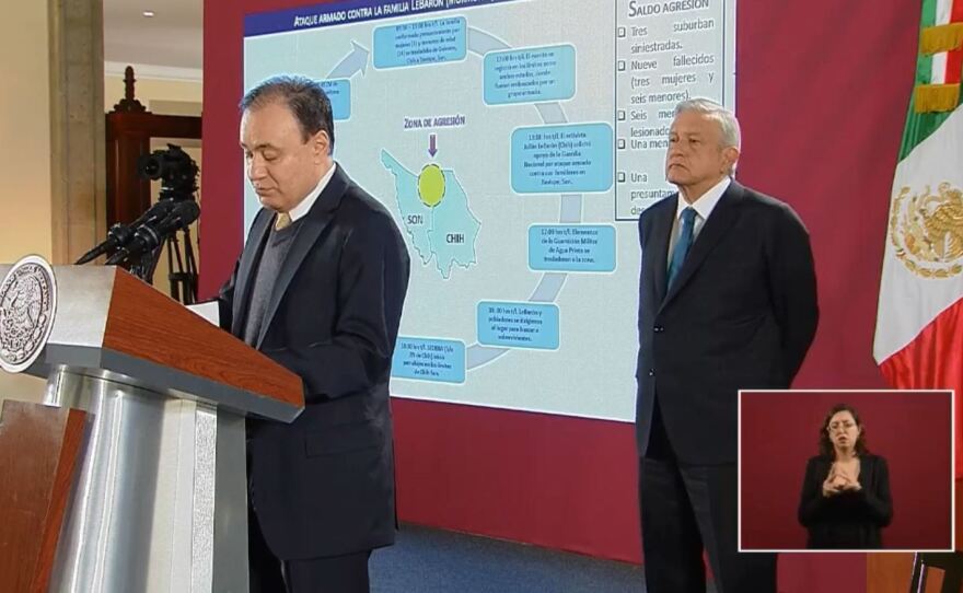 Members of the extended LeBaron family were caught in a brutal attack, Mexican officials say. Here, President Andrés Manuel López Obrador looks on as Security Minister Alfonso Durazo discusses the attack during a news conference Tuesday morning.