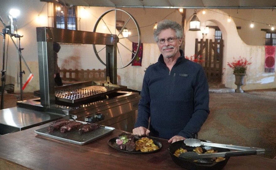 Steven Raichlen with ribeye and smashed potato.