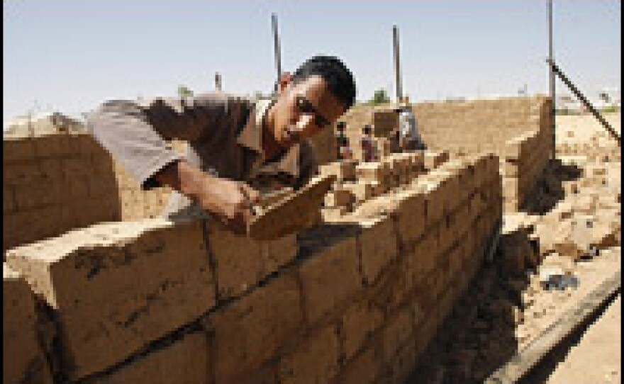 Palestinians build a house in Rafah, southern Gaza Strip. International donors have pledged billions of dollars in reconstruction aid, but Israel is preventing building materials such as cement and steel reinforcement rods from entering the Gaza Strip, saying they could be used by Hamas for military purposes.