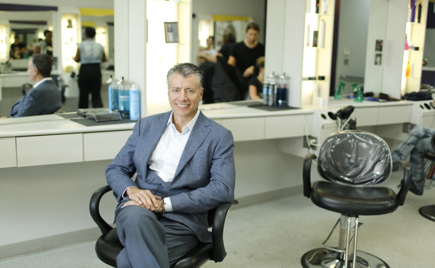 Gary Robins sits in the chair of his Supercuts salon in Media, Pa., one of 41 he owns throughout Philadelphia and Delaware.