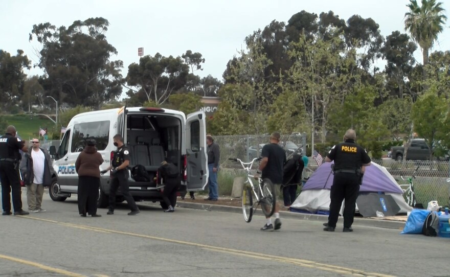 Oceanside Police Department's Homeless Outreach Team helps clear out people living at the homeless encampment on South Oceanside Blvd. and transports them to motels. April 13, 2021.