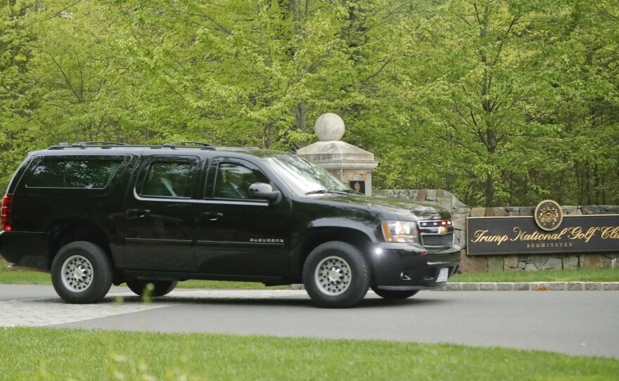 Riding in a motorcade, President Trump leaves the Trump National Golf Club in Bedminster, N.J., earlier this year.