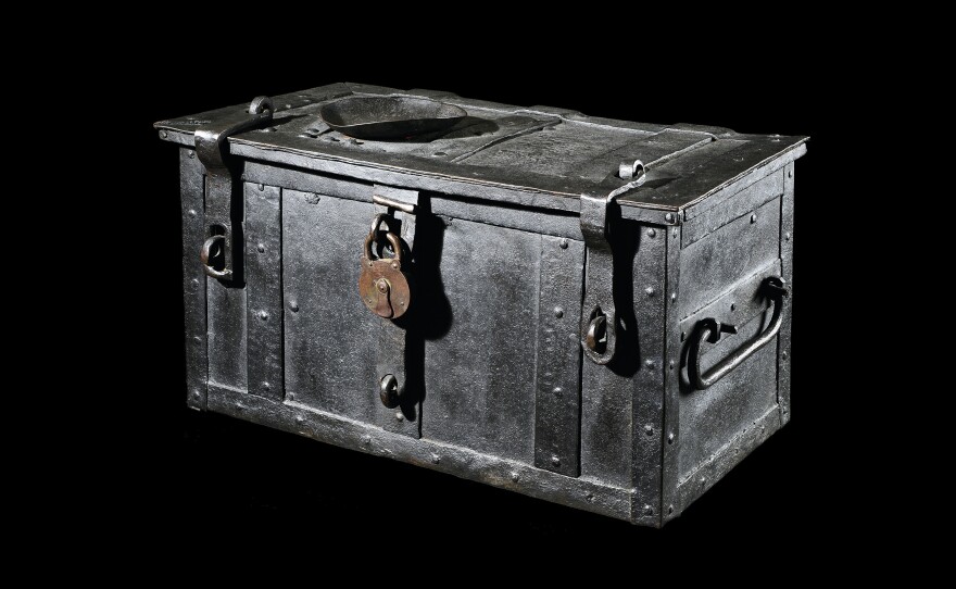 Indulgence Chest, 16th century with a padlock from 20th century. The trunk was used by a Catholic Church to collect money from followers who wanted a reduced time in purgatory. Martin Luther believed this type of donation was church corruption.