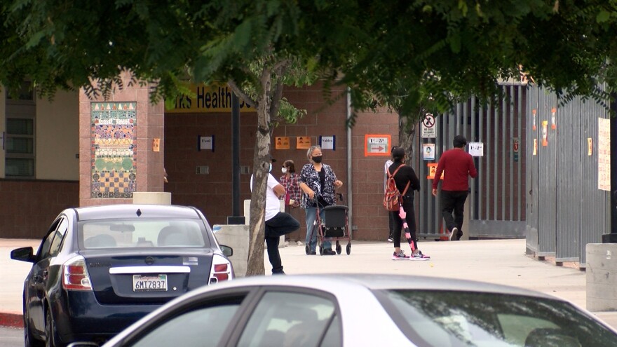 Parents waiting outside Rosa Parks Elementary in City Heights October 6, 2021