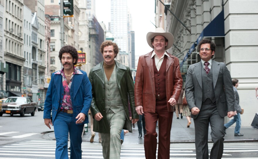 Paul Rudd, Will Ferrell, David Koechner and Steve Carell feel the perm in "Anchorman 2."