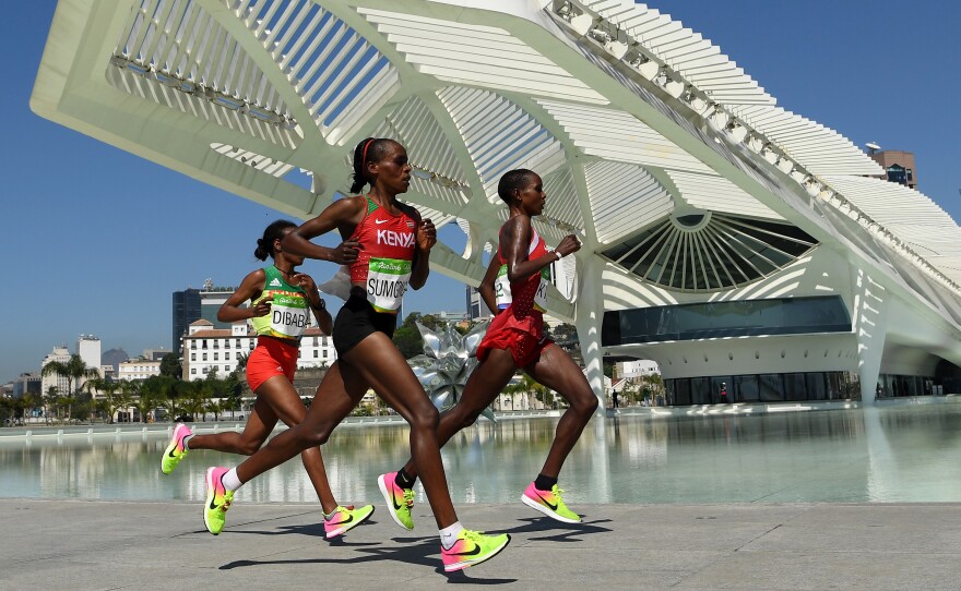 Kenya's Jemima Sumgong  (center) won the women's marathon Sunday in Rio. Bahrain's Eunice Kirwa (right) won silver, while Ethiopia's Mare Dibaba finished third. While Kenyan women have often medaled, Sumgong was the first from her country to win the event.