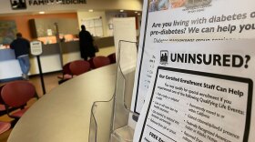 A flyer at the Family Health Centers of San Diego clinic in southeast San Diego advertises Medi-Cal enrollment assistance to uninsured patients but features a now-outdated list of requirements that include legal California residency, Dec. 31, 2019. 