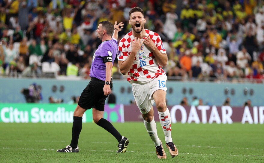 Bruno Petković of Croatia celebrates after evening the game 1-1 in extra time against Brazil in the World Cup quarterfinals on December 09, 2022 in Al Rayyan, Qatar.