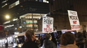 People in favor of healthcare for transgender youth march outside NYU Langone hospital in New York City in February 2025.