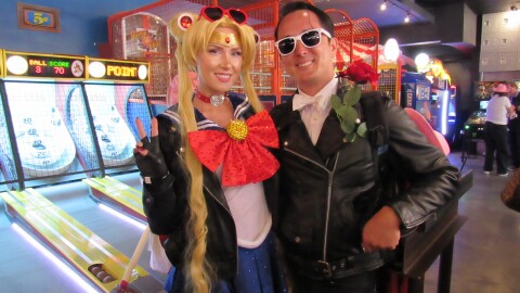 From left: Cherish and Valor McConnell dress as biker Sailor Moon and Tuxedo Mask at Coin-Op for the "Dungeon Crawler Carl" activation on July 26, 2025. 
