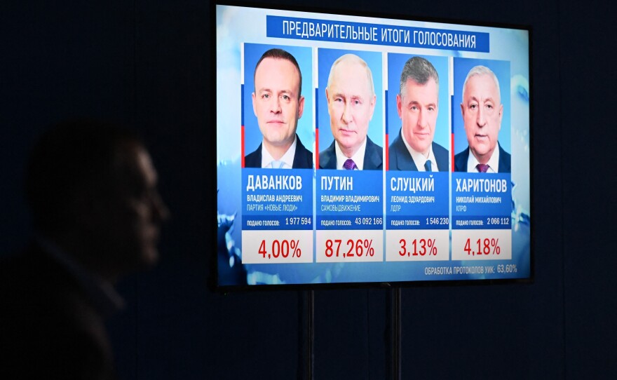 Preliminary results of the presidential election are displayed on a screen at the campaign headquarters of Russian President and presidential candidate Vladimir Putin in Moscow on March 17, 2024.