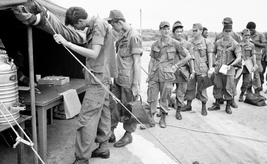 U.S. soldiers at Long Binh base in South Vietnam line up to give urine samples at a heroin detection center before departing for the United States. About 20 percent of soldiers said they were addicts, but most didn't continue drug use back home.