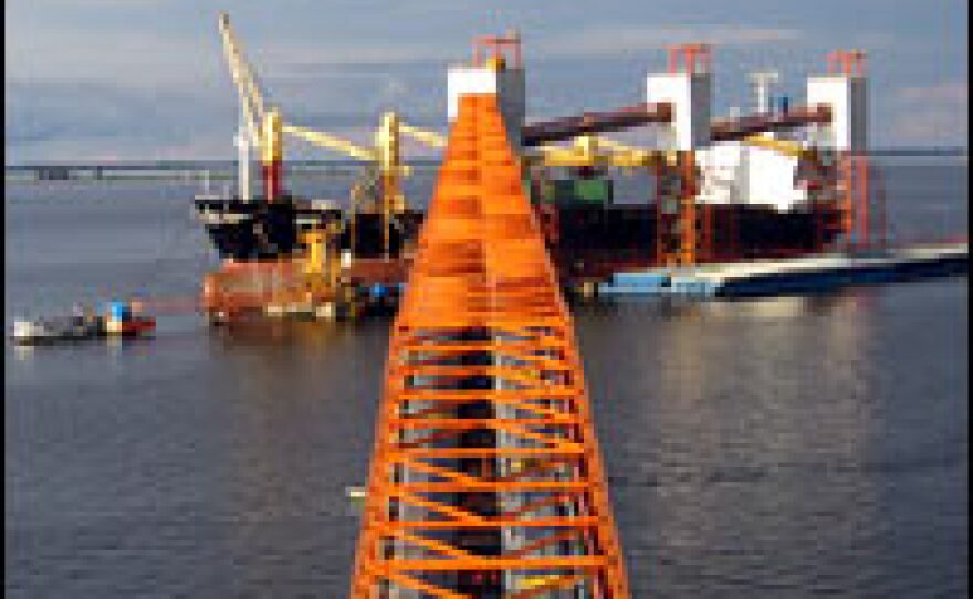 At a rate of 1,200 tons per hour, soy is transferred to the hull of a tanker at Cargill's port in Santarem, Brazil, that will carry the commodity out of the Amazon, destined for markets in Europe and Asia. China's huge demand has attracted soy farmers to the Amazon.