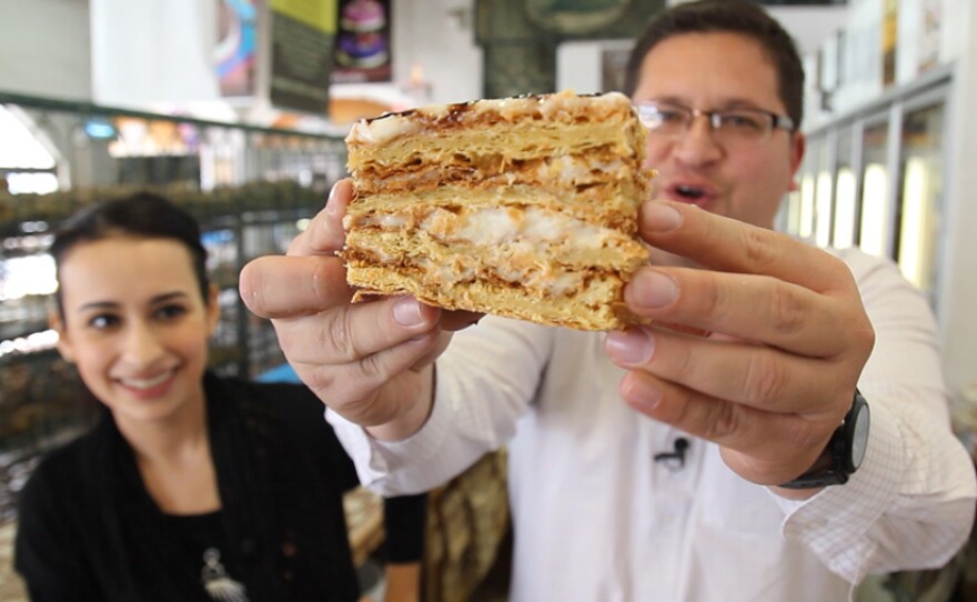 Host Jorge Meraz samples some sweet bread in the El Mejor Pan de Tecate store, Tecate, Baja California, Mexico.