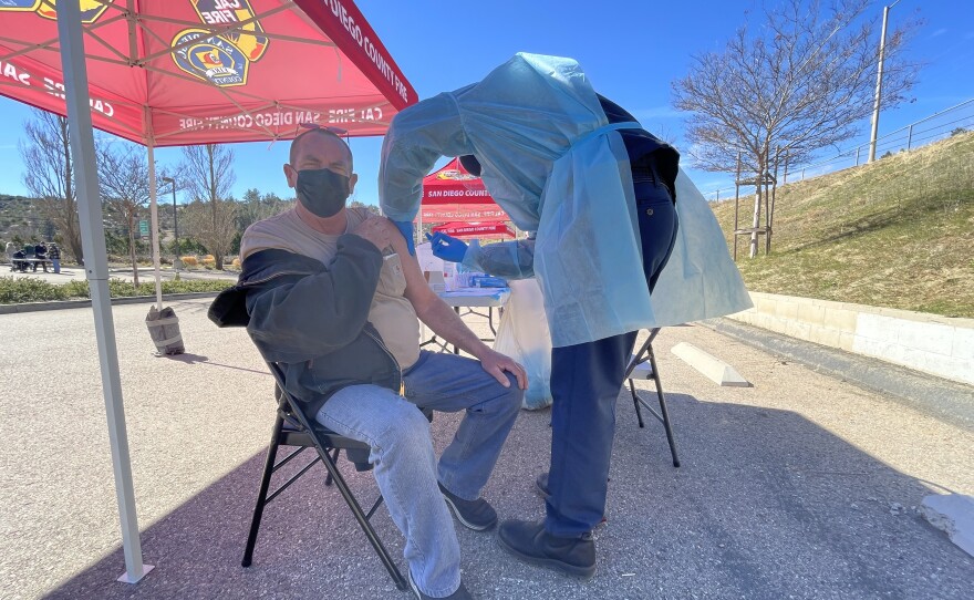 A man receives a COVID-19 vaccine from Cal Fire in Julian, Calif. Feb. 3, 2021.