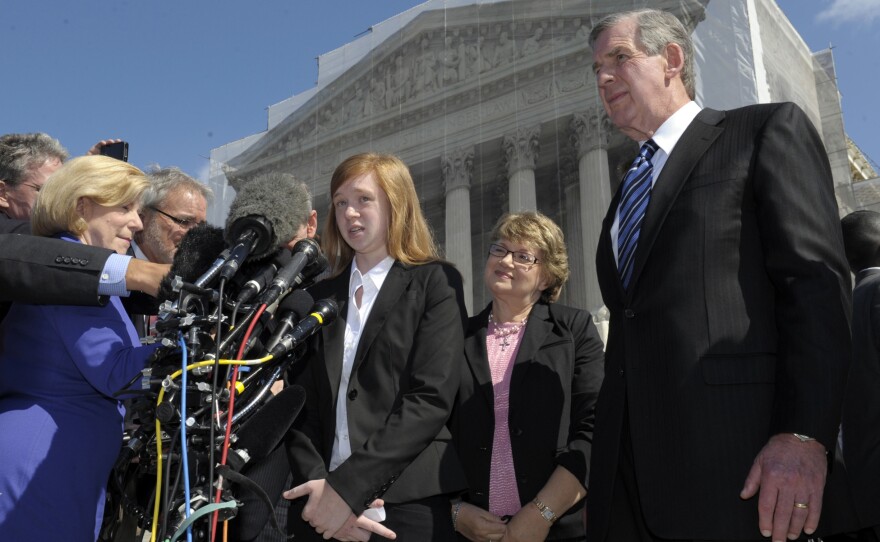 Abigail Fisher, the Texan involved in the University of Texas affirmative action case, accompanied by her attorney Bert Rein, right, talks to reporters outside the Supreme Court in October.