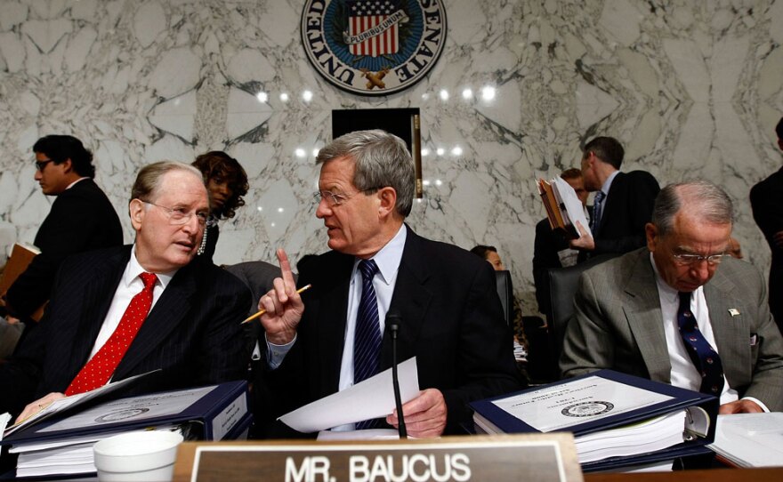 Democratic Sen. John Rockefeller of West Virginia (left) talks with Senate Finance Committee Chairman Max Baucus (D-MT) before the panel's vote Tuesday in Washington, D.C.