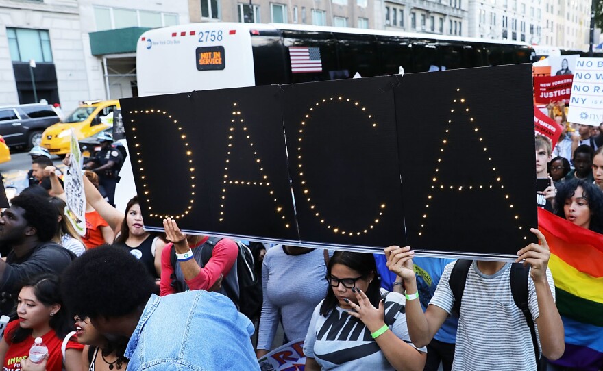 DACA advocates march near Trump Tower in August in New York City. The government says it will resume DACA renewals.