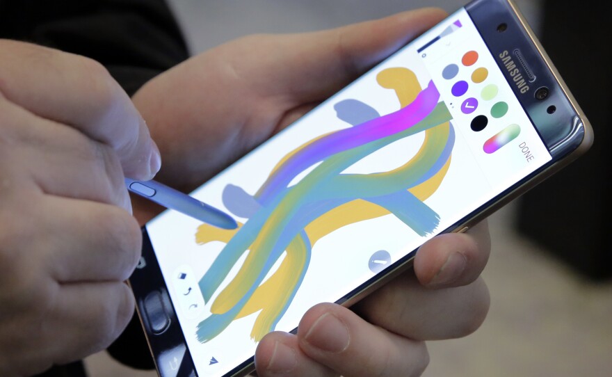 Samsung's Galaxy Note 7 is demonstrated in New York on July 28. All owners of the new smartphone have been urged to exchange the device after reports of phones' exploding or catching fire.