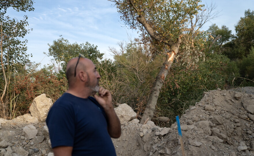 Julio Enfedaque stands at the edge of a construction site where an outflow pipe will be installed that he says will carry water from a nearby Amazon data center in Villanueva de Gallego, Spain, on Sept. 27. Farmers in the region are concerned about the water these data complexes require. In this region already affected by frequent droughts, they fear they will be in competition for the resources to grow their crops.