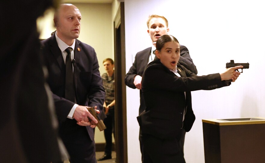 Secret service agents respond after shots were fired during the White House Correspondents' Dinner on Saturday.