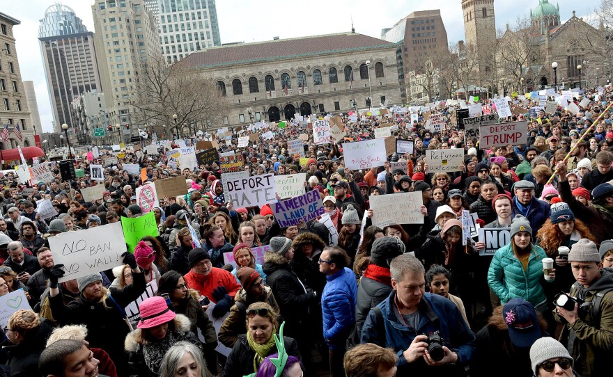 People gather in Boston's Copley Square to protest the immigration ban enacted by President Trump.