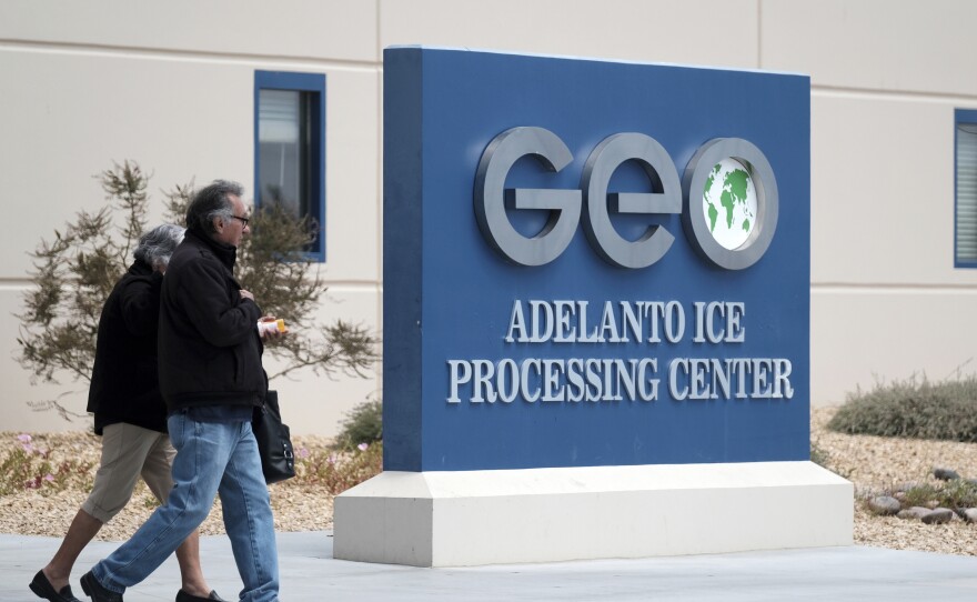 This April 20, 2019, file photo shows the U.S. Immigration and Enforcement Processing Center operated by GEO Group, Inc. (GEO) a Florida-based company specializing in privatized corrections in Adelanto, Calif.