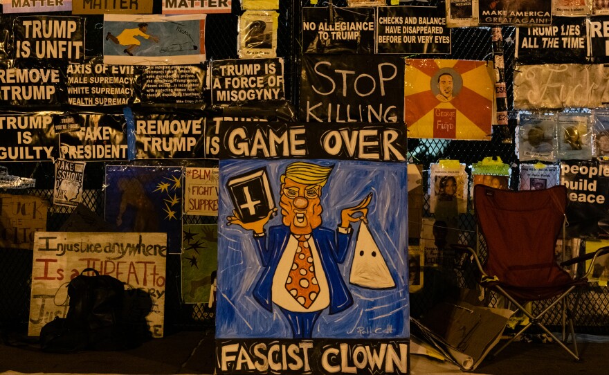 Signs on the fence surrounding the White House on Nov. 4, 2020. The majority of the artwork featured on the fence will be preserved in an archive in partnership with Baltimore's Enoch Pratt Free Library.