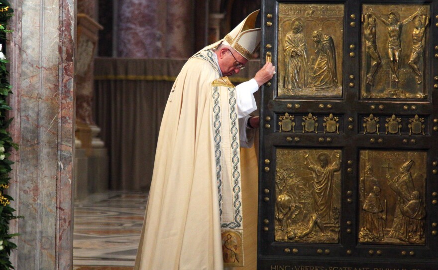 Pope Francis closes the Holy Door in St. Peter's Basilica on Sunday in Vatican City, marking the end of the Jubilee Year of Mercy.