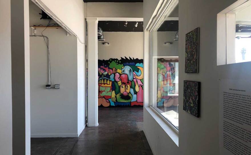 An interior exhibition at The Front gallery features smaller works and an indoor mural by muralist Juan Carlos Galindo (GRVR), pictured on September 25, 2020.