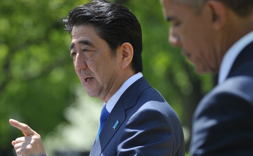 Japan's Prime Minister Shinzo Abe speaks during a joint press conference at the White House with President Obama on Tuesday. Abe is urging U.S. lawmakers to approve a trans-Pacific trade deal.