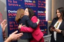 Denise Powell, candidate for the Democratic nomination to the House of Representatives in Nebraska's second district, right, hugs pollster Madeline Conway during an election night watch party Wednesday in Omaha, Neb.